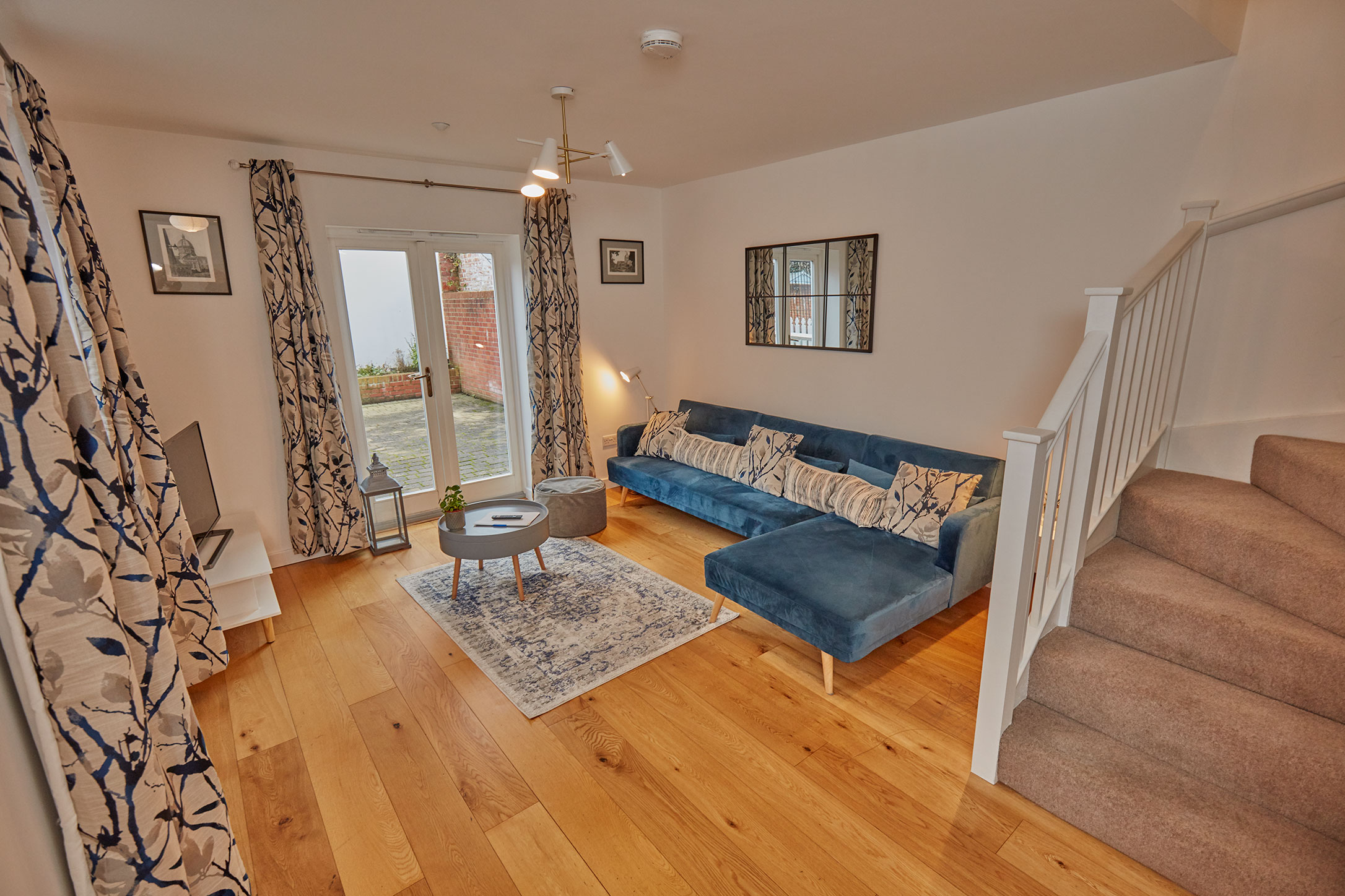 The sitting room at Barlows Mews opening onto the private patio