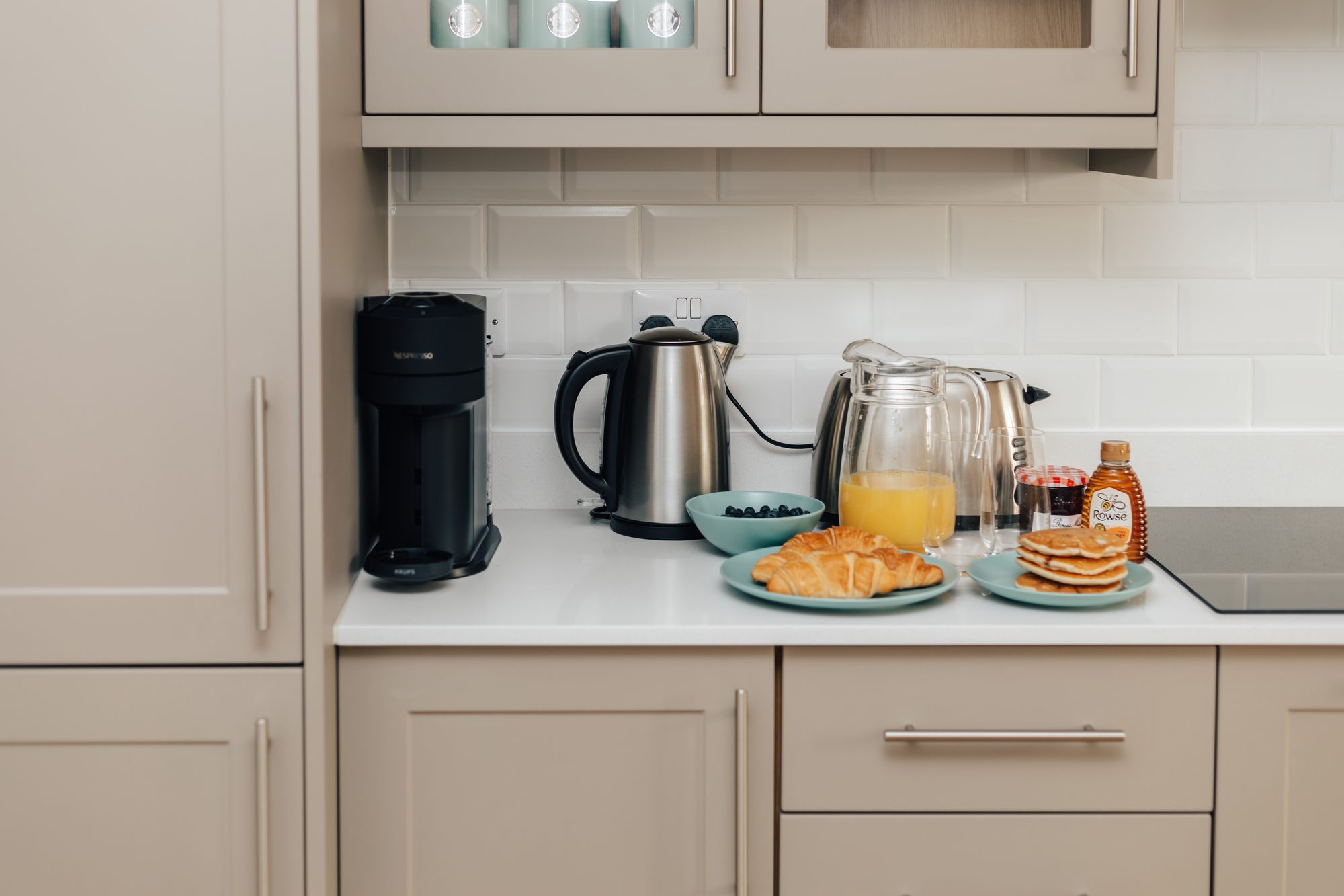 Kitchen worktop with coffee machine, kettle and a breakfast spread