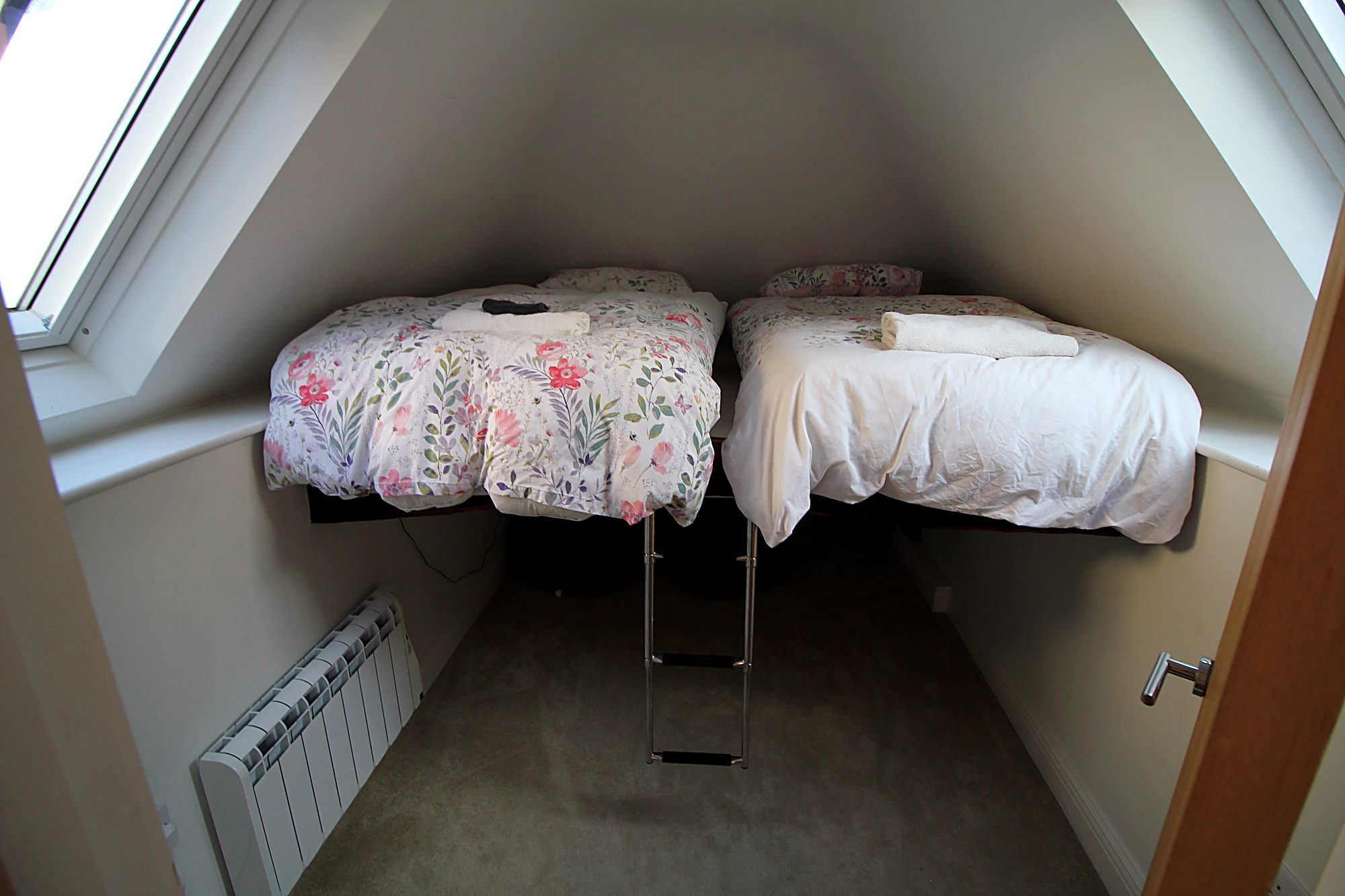 Twin loft bedroom with ladder access